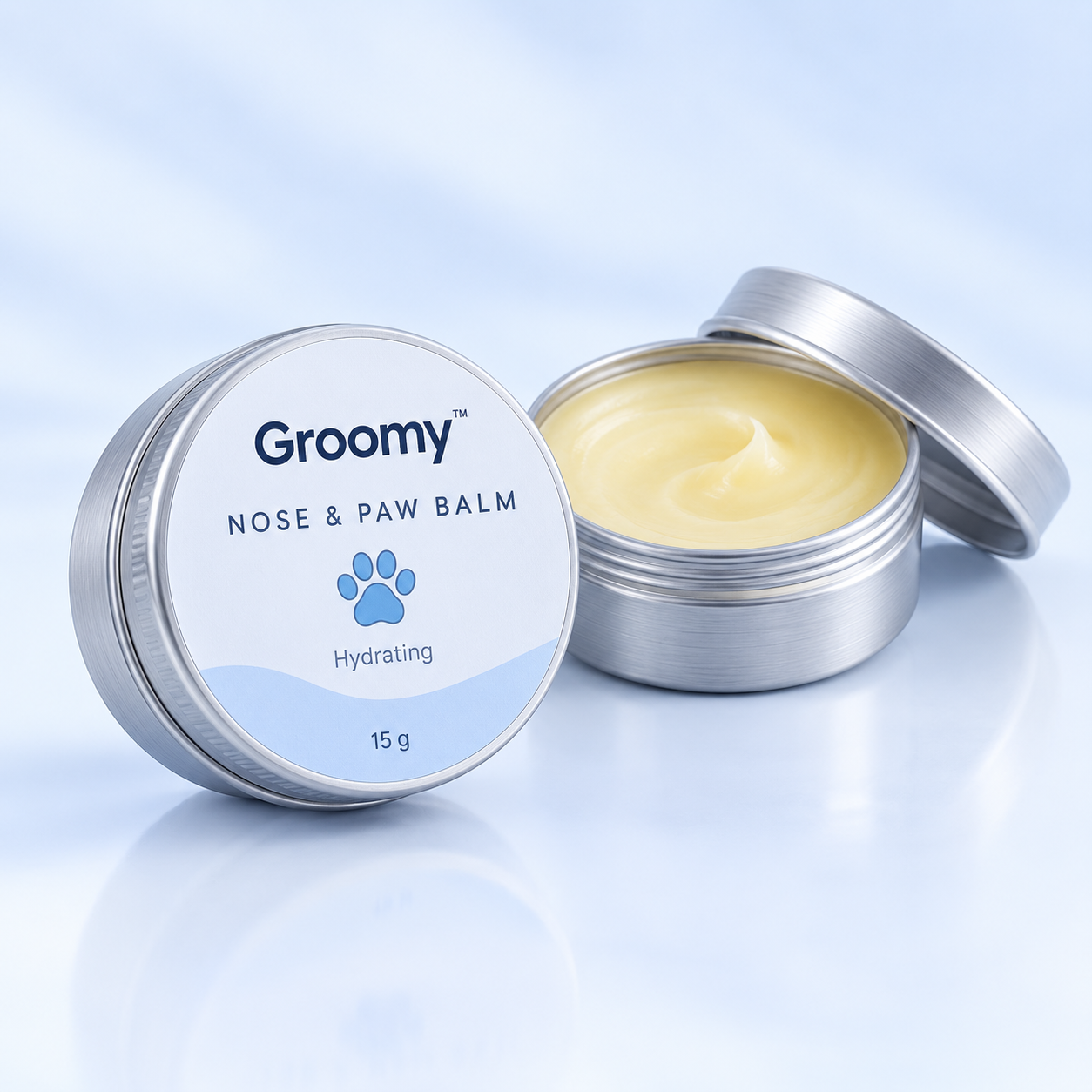 Groomy Nose & Paw Balm in a small aluminium tin, one open showing the balm.